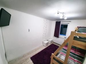 Televízia a/alebo spoločenská miestnosť v ubytovaní Apartment for your Holiday