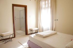 Postel nebo postele na pokoji v ubytování Riverfront Homestay