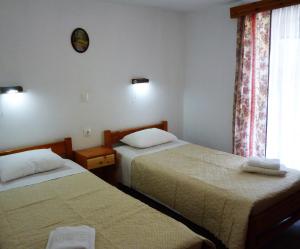 Postel nebo postele na pokoji v ubytování Giannis