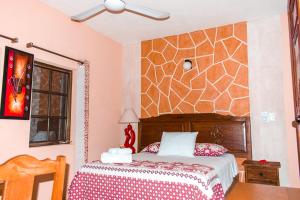 Postel nebo postele na pokoji v ubytování Hotel Mayahau Coba
