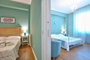A bed or beds in a room at B&B Del Corso