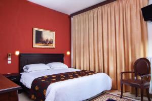 Ένα ή περισσότερα κρεβάτια σε δωμάτιο στο Arktos Suites