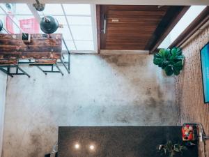 a room with a table and plants on the wall at Haus Sathorn 11 Residence in Bangkok