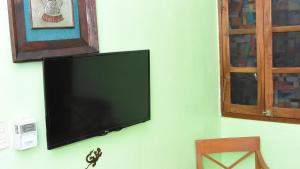TV a/nebo společenská místnost v ubytování Cancun Guest House 6 + 15 fotografií