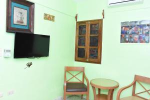 TV a/nebo společenská místnost v ubytování Cancun Guest House 6