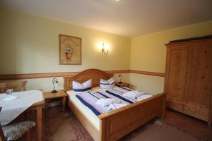 Postel nebo postele na pokoji v ubytování Landhaus Alt Reddevitz
