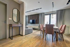 Televízia a/alebo spoločenská miestnosť v ubytovaní Alpin Apartments Jahorina