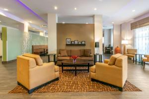 a hospital lobby with two chairs and a table at Sleep Inn & Suites in Columbia