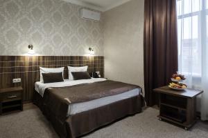 Postelja oz. postelje v sobi nastanitve Petrovsky Hotel