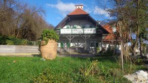 a large house with a green and white building at Hirschenhof in Graz