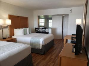 Giường trong phòng chung tại Studio 1 Motel - Daytona Beach