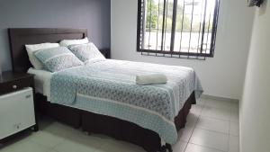 Cama ou camas em um quarto em Hotel Tazumal House