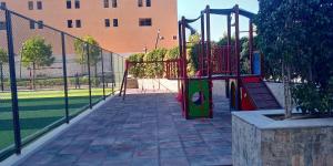 a playground with a slide in a park at دوبلوكس نيو بورتو كايرو القاهرة الجديدة للعائلات فقط in Cairo