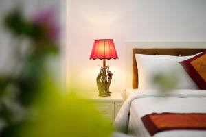 Ένα ή περισσότερα κρεβάτια σε δωμάτιο στο Busan Hotel