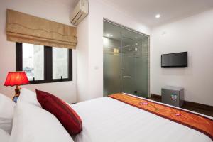 Ένα ή περισσότερα κρεβάτια σε δωμάτιο στο Busan Hotel