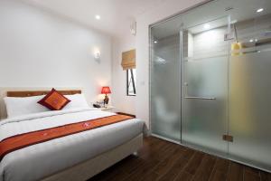 Ένα ή περισσότερα κρεβάτια σε δωμάτιο στο Busan Hotel