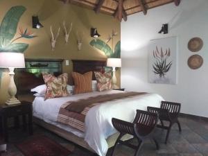 
A bed or beds in a room at Lodge Afrique
