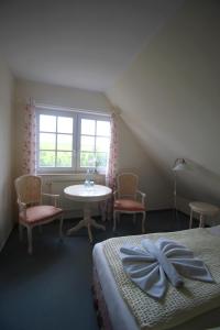 Postel nebo postele na pokoji v ubytování Landhaus Alt Reddevitz