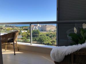 a room with a window with a view of the city at Apartment Charming in Split