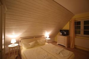 Postel nebo postele na pokoji v ubytování Landhaus Alt Reddevitz