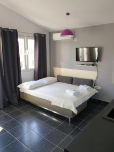 Cama o camas de una habitación en Apartments Zdenka