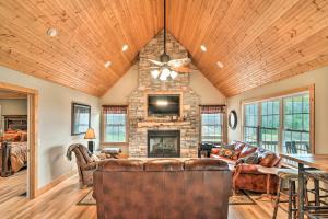 a living room with a couch and a fireplace at Mountain-View Franklin Retreat: Near Hiking! in Franklin