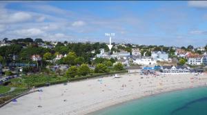 an aerial view of a beach with people on it at No.10 Falmouth - 2 minutes walk to the beach in Falmouth