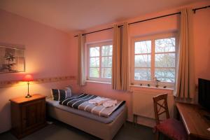 Postel nebo postele na pokoji v ubytování Landhaus Alt Reddevitz