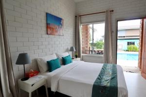Tempat tidur dalam kamar di Casa Tanjung Jara
