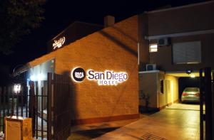 a sign on the side of a building at night at San Diego in La Falda