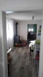 a living room with a woodburning stove in a room at Liebevolle Fewo im Bayerischen Wald in Witzmannsberg