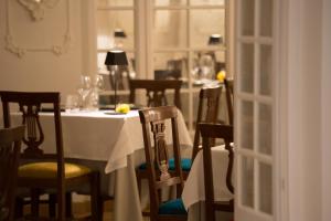 a dining room with a white table and chairs at Mediterraneo Emotional Hotel & Spa in Santa Margherita Ligure