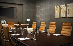 a conference room with a long table and chairs at Sheraton Baku Intourist in Baku