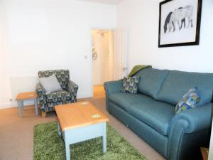 A seating area at Homely and well appointed Priory Apartment by Cliftonvalley Apartments