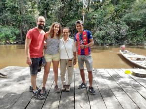 a group of people standing on a wooden bridge at Lodge Jungle Wolf Expeditions in Yucuruche