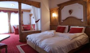 Postel nebo postele na pokoji v ubytování Hotel Belvedere Srl