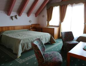 Postel nebo postele na pokoji v ubytování Hotel Belvedere Srl