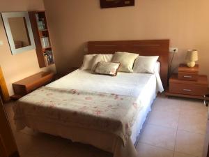a bedroom with a large bed in a room at Apartamento las Yucas - Aguilas in Águilas