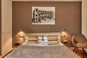 Tempat tidur dalam kamar di UD Apartments - Luxury Beach Apartment with Terrace