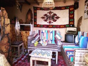 a living room with a couch and a table at Atlas Room in Midelt +53 photos