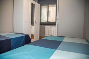 Posteľ alebo postele v izbe v ubytovaní Apartamento Reus 2 - Parking gratuito