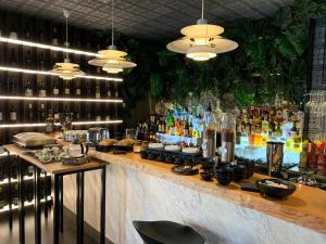 a bar with a lot of bottles of alcohol at Hotel Pontemare in Palermo