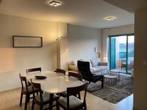 a living room with a table and a couch at Casa Toboso 2 in Torre del Mar