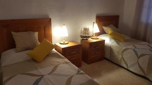 En eller flere senge i et værelse på Casa del mar