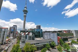 a view of a city with the cn tower in the background at QV Stays City Central Apartment with Parking in Auckland +5 photos