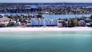 an aerial view of a beach with a hotel at Sunset Chateau Beach Front Condo Star5Vacations in St Pete Beach