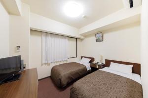 TV a/nebo společenská místnost v ubytování Dai-ni Sunny Stone Hotel