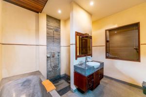 Koupelna v ubytování De Munut Balinese Resort