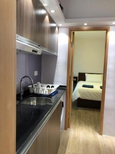 Un pat sau paturi într-o cameră la New hoover hostel