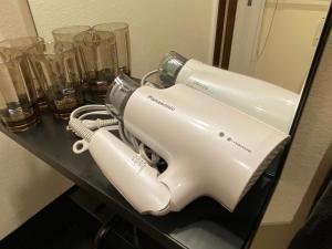 a white mixer sitting on a table with glasses at Kyunoju in Okayama
